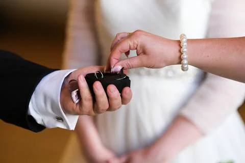 Taking out  a wedding ring Stock Photos
