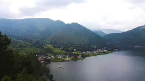 Taking over Lake Toba from the corner of the hill Stock Footage 213919713