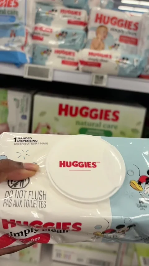 Taking a package of Huggies Simply Clean from a store shelf Stock-Footage 334963010