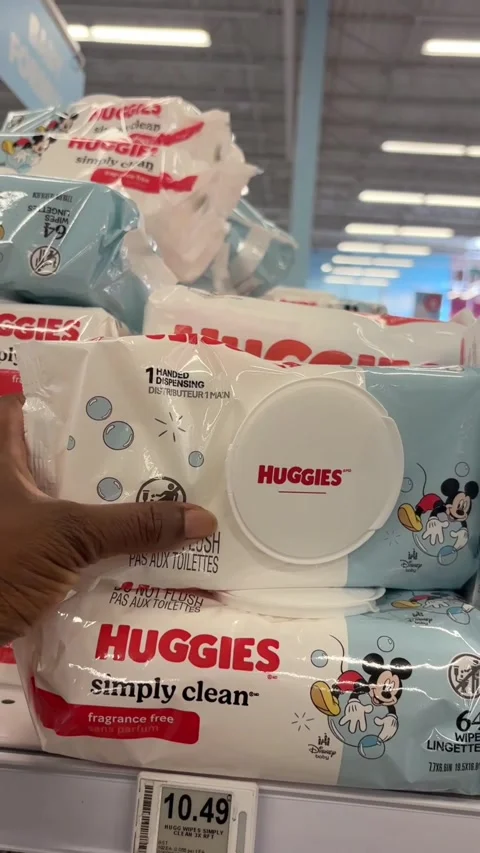 Taking a package of Huggies Simply Clean from a store shelf Stock Footage 334963011
