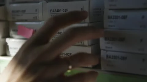 Taking Packages From Shelf 2 Stock Footage 49544868