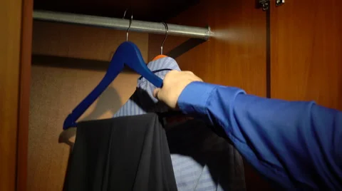 Taking pants from a wardrobe Stock Footage 60056676