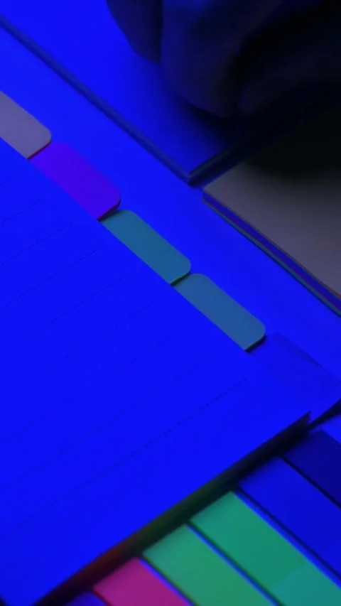 Taking paper from notebooks with colored page tabs. 動画素材 335328250