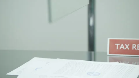 Taking papers at tax refund office at the airport Stock Footage 247710176
