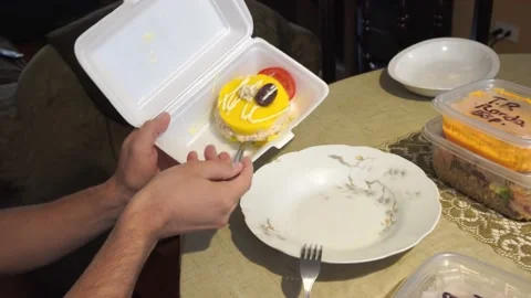 Taking a Peruvian stuffed food from a plastic container brought Stock Footage 154813738