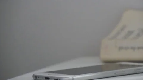 Taking phone in table nightstand Stock-Footage 102832839