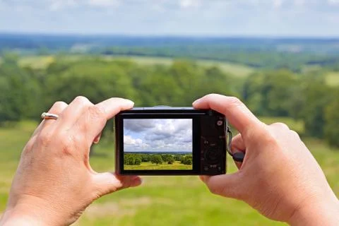 Taking a photo with a compact camera Stock Photos