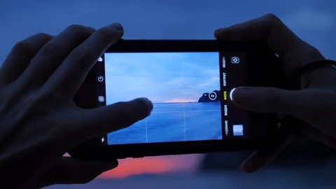 Taking photo during sunset Stock Footage 129318788