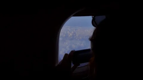 Taking photos in the airplane Stock Footage 89223063