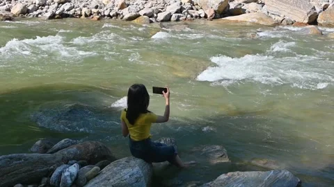 Taking Photos of a Mountain River on a Smartphone Video stock 340277541