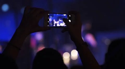 Taking a picture at a concert with smartphone in slow motion Stock-Footage 59798295
