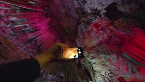 Taking picture inside cave in Gibraltar in 4k slow motion 60fps Video stock 143685817