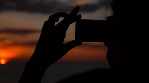Taking Picture of sunset Stock Footage 41903629