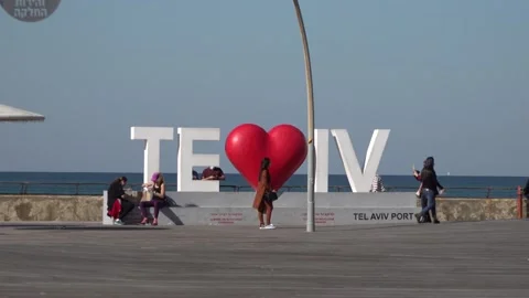 Taking pictures in front of "Loving Tel-Aviv"  Namal Tel Aviv, Tel Aviv Port Stock Footage 150740728
