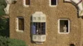 Taking pictures from the stone building window in Park Guell, Barcelona 4k or 4k+ Resolution