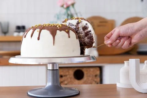 Taking a piece of cake with a spatula. Foto stock