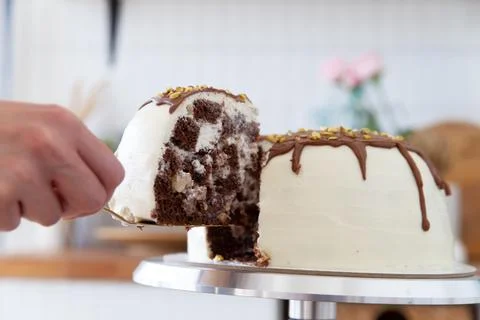 Taking a piece of cake with a spatula. Stock Photos