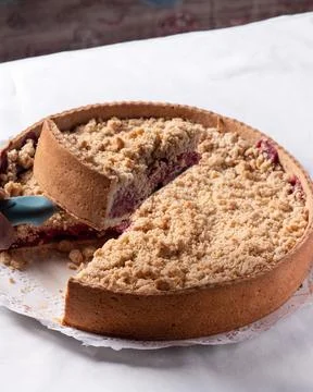 Taking a piece of Cherry kuchen off the table Fotos de archivo