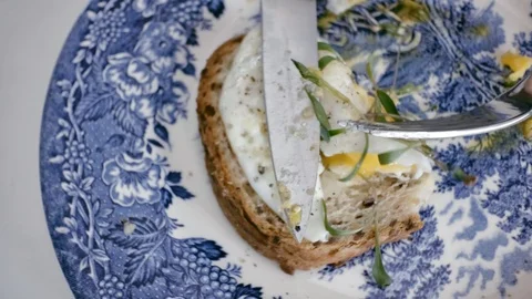Taking a piece of sandwich bread with egg and sprouts on top Stock Footage 92146514