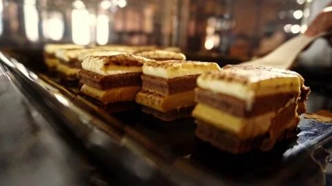 Taking a piece of tiramisu cake, open buffet Stock Footage 224315872