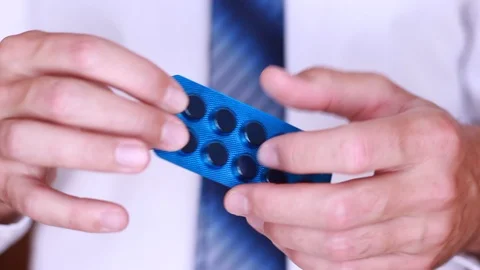 Taking pill from pack Vídeo Stock 90442726