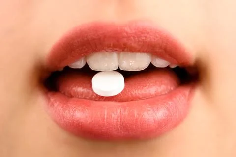 Taking a pill Stock Photos