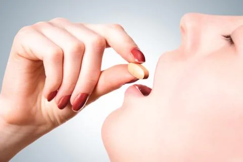 Taking a pill Stock Photos