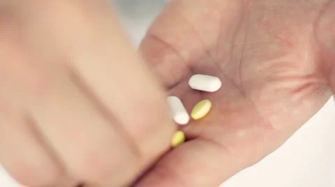 Taking pills from the hand, closeup HD Stock Footage 2903126