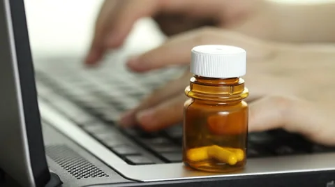 Taking  pills or vitamins to keep working Stock Footage 34632775