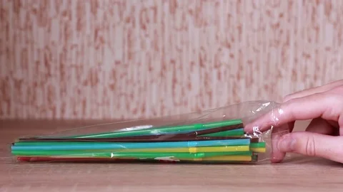 Taking plastic cocktail tubule Vídeo Stock 83532425