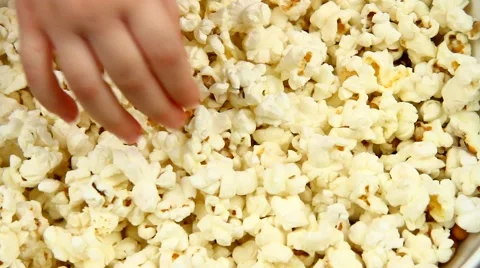 Taking pop-corns Stock Footage 46994827