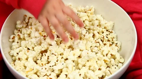Taking pop-corns Stock Footage 46995033