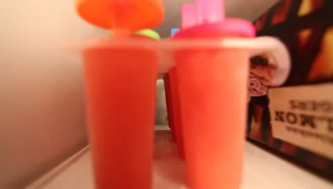 Taking Popsicles from freezer POV Stock Footage 10905204