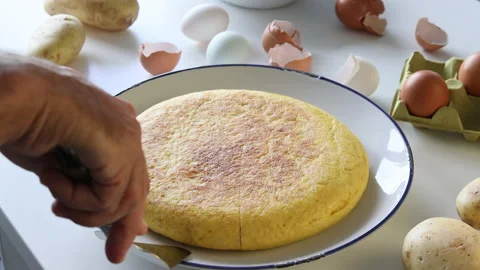 Taking a portion of Spanish omelette. Tortilla espanola. Close up Stock Footage 197117202