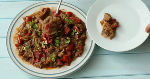 Taking a portion of vegetarian stew Stock Footage 295066522