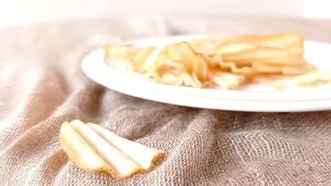 Taking a potato chip on a white plate Stock Footage 146251345