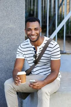 Taking a quick break. A handsome casually dressed african american businessman Stock Photos