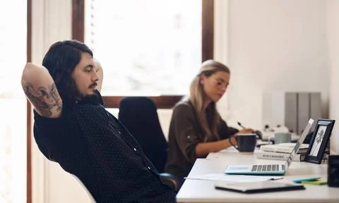 Taking a quick timeout before continuing with his plans. a young businessman Stock Photos