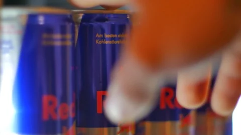 Taking redbull out of the fridge Stock Footage 122243619
