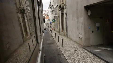 Taking a ride aboard a tram through Lisbon's neighborhoods Video stock 69832944