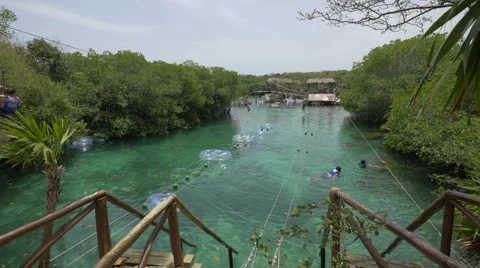 Taking a ride with the zip line at Xel-Ha Park in Cancun Stock Footage 50278920