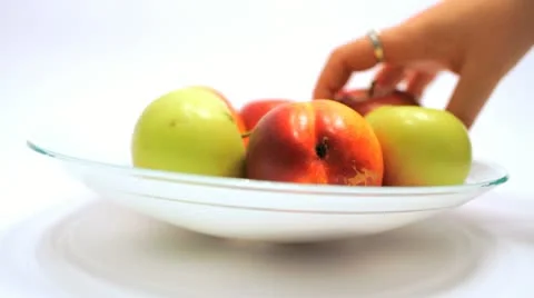 Taking Ripe Apples and Nectaries from a Vase Stock Footage 11204138