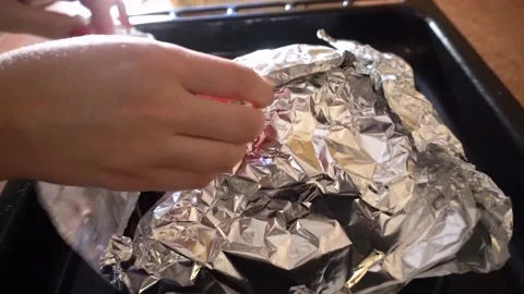 Taking roasted chicken out of oven, turkey on baking sheet. Thanksgiving food Stock Footage 221692039