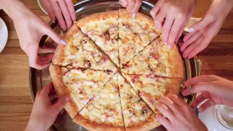 Taking salami pizza slice via spatula. A hot melted cheese is stretching, 库存影片 336586698