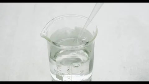 Taking a sample of a clear liquid Stock Footage 308243559