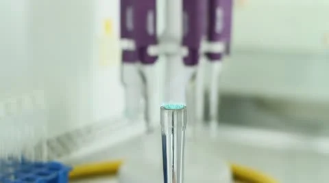 Taking a sample in a glass container Stock Footage 11858719