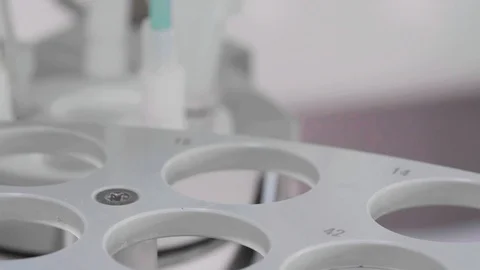 Taking sample from test tube Stock Footage 116824884