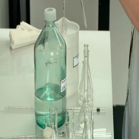 Taking samples in a test tube in a laboratory Stock Footage 69515171