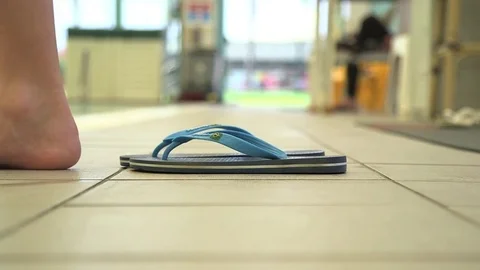 Taking of sandals at the pool Video stock 76050209