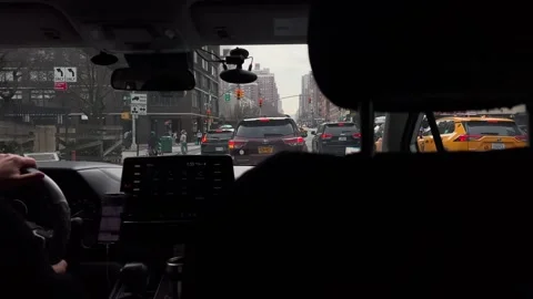 Taking a scenic drive through the bustling city streets on overcast cloudy day 動画素材 291510301